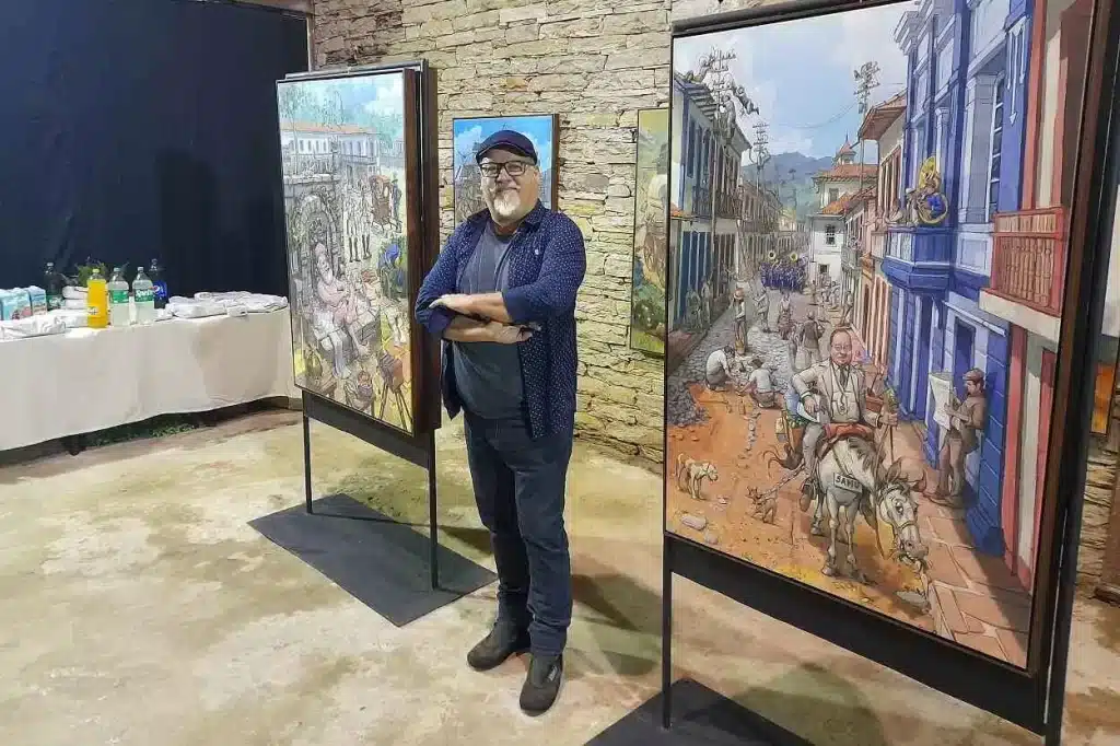 Camaleão, ao lado de 2 dos 30 quadrões em exposição